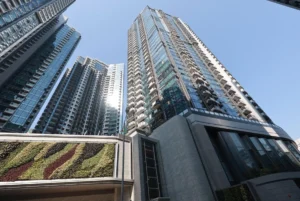 Low angle view of modern glass skyscrapers reaching into a clear blue sky
